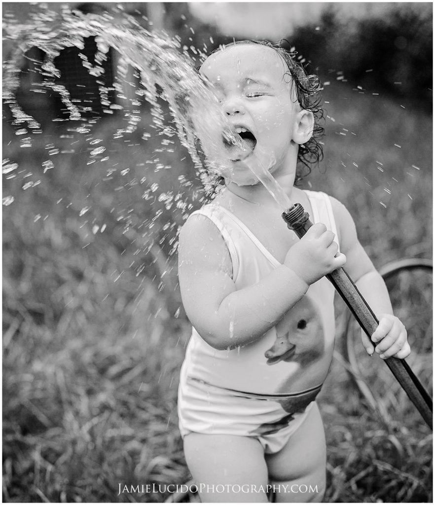 child with hose, backyard hose, real life photography, childrens photographer