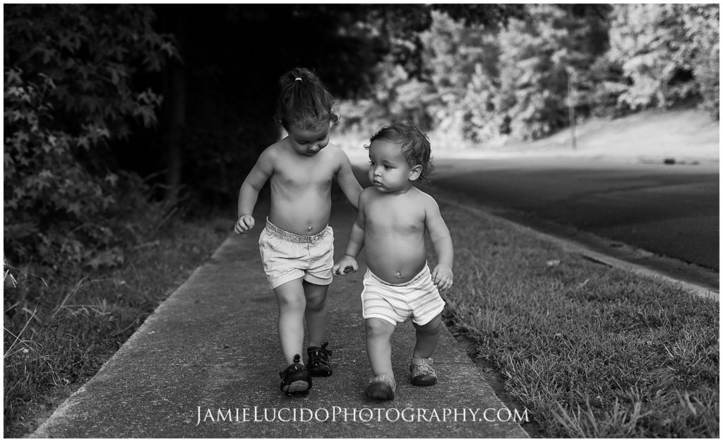 real life photos, professional photography, children walking, siblings, family photographer, charlotte phogotrapher