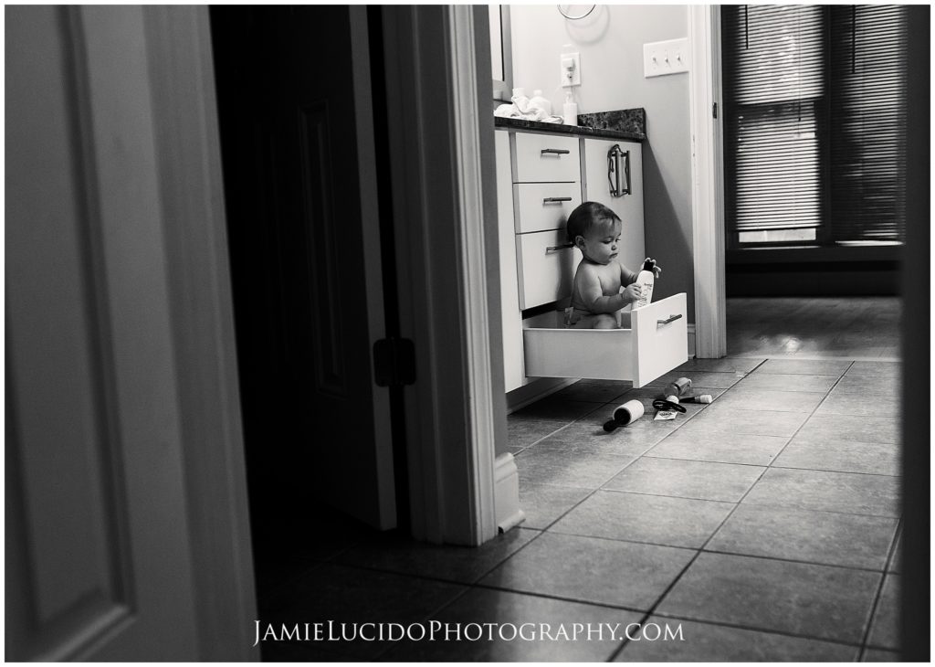 child in bathroom drawer, child in bathroom, baby explorer, funny baby photos, documentary photographer