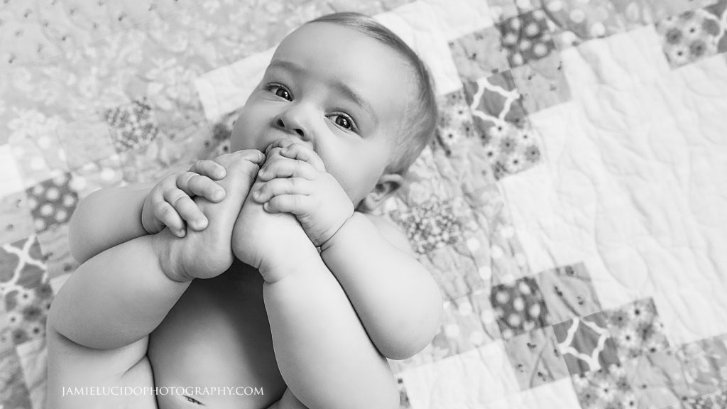 baby eating toes