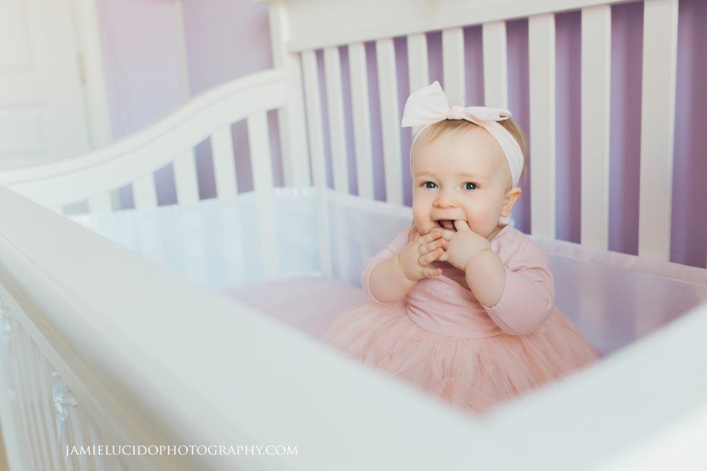 lifestyle session baby girl in crib with tutu charlotte children photographer
