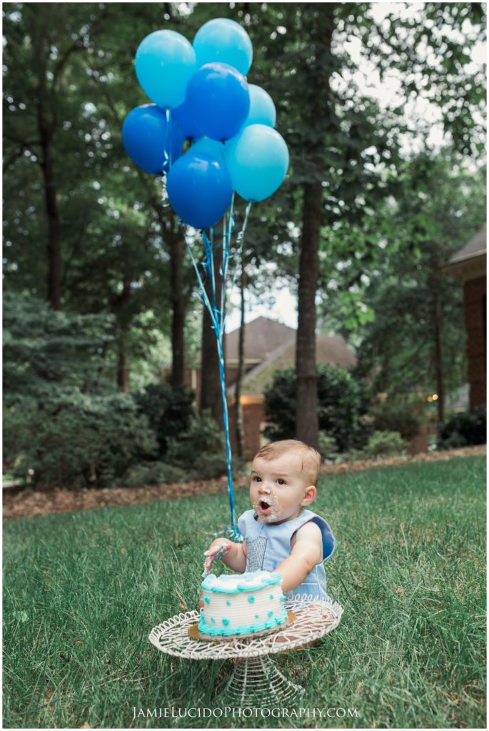 baby portrait, cake and balloons, baby in yard, first birthday, cake smash, charlotte family photographer, birthday portrait