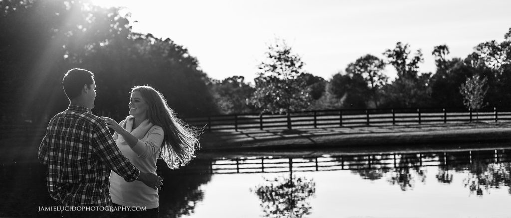 engagement session couple dancing by lake at morning glory farm