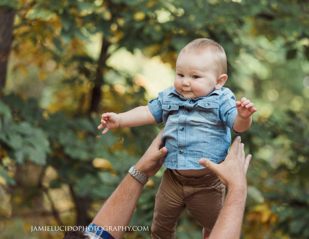 child in air, baby toss, father and son, documentary family photography, documentary photography, family photography, natural photography, fall portrait
