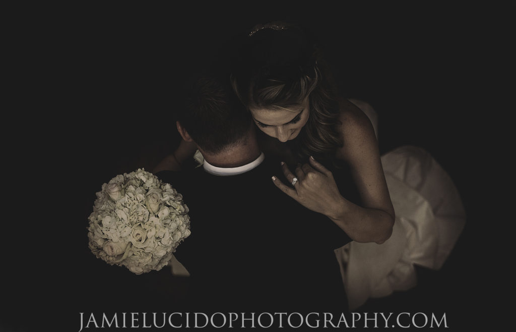 bride and groom embrace after ceremony