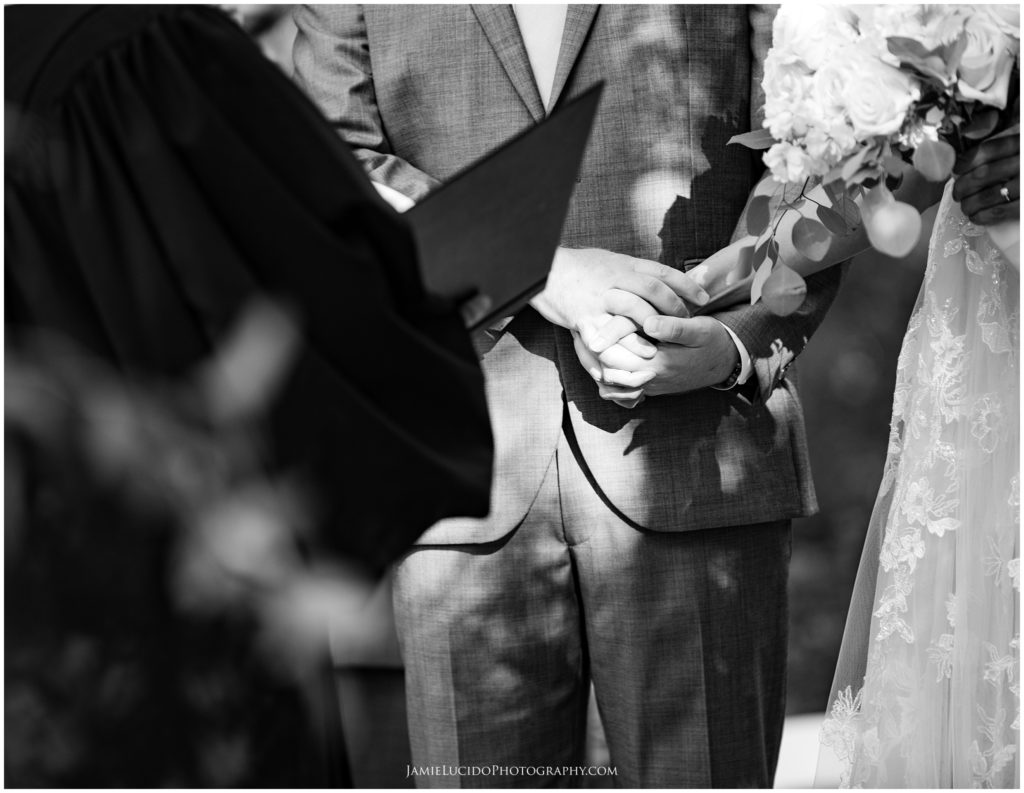 bride and groom, holding hands, wedding moment, black and white photography