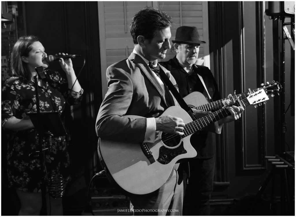 reception music, groom, guitar, fan for life, black and white documentary, wedding photography