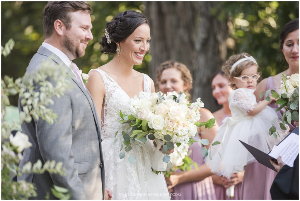 bride and groom, sharing vows, wedding ceremony, outdoor wedding