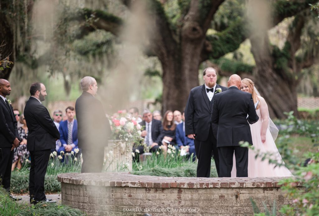 bride and groom during ceremony, outdoor ceremony, garden wedding