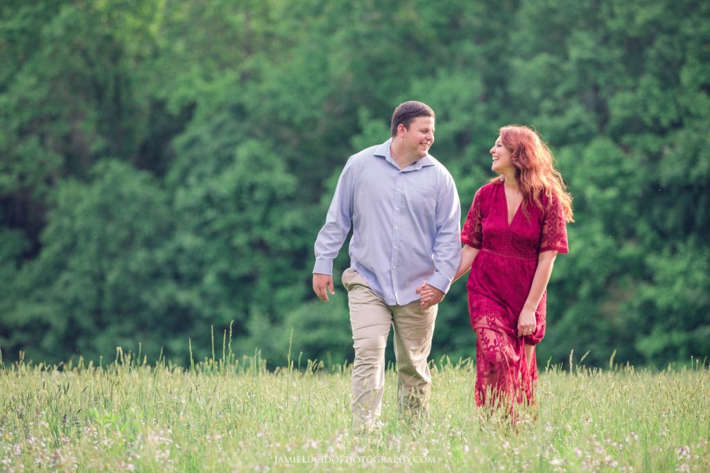 engagement session, walking through field, photography in a field